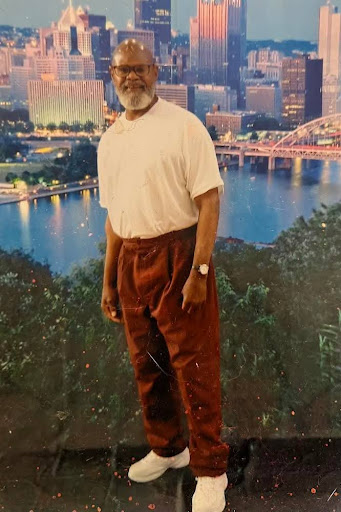 Christopher Martin. Photo taken in prison in front of Pittsburgh skyline backdrop 